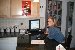 As promised, here is a picture of the new kitchen computer.  Heather uses it to stay up-to-date on her version of Jackassery, which is dedicated to wedding bullshit.  I also tacked up a sweet Sin City poster I just got off Ebay.